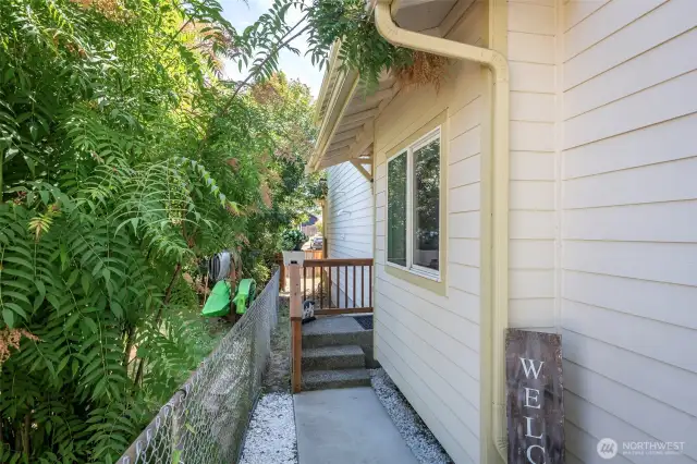 Upper unit enterance on left side of property.