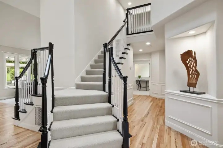 Updated stairway and lighted art niche.