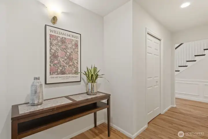 Hallway with guest powder bath and bonus room.