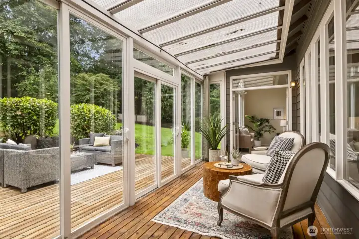 2 sets of French doors lead to the sunroom.