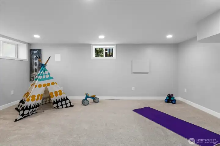 The rec room on the lower level is filled with light. New carpet makes it cozye.