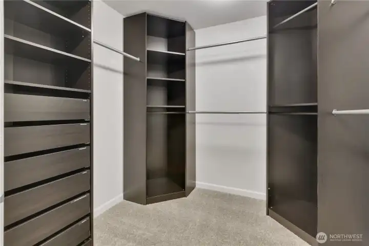 One of two walk in closets in primary bedroom