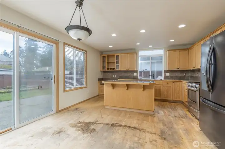 Large kitchen and breakfast nook with slider to back yard
