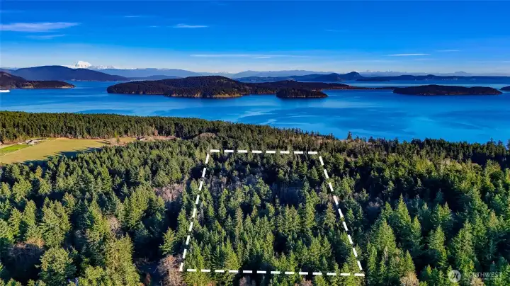 Looking east over subject property. Views of Lopez Sound, Thatcher Pass, Rosario Straight, Decator Island and Center Island