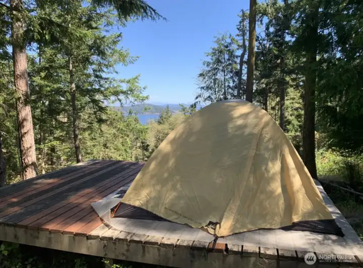 Looking east at tent platform and views beyond. Owner provided photo taken August 2022