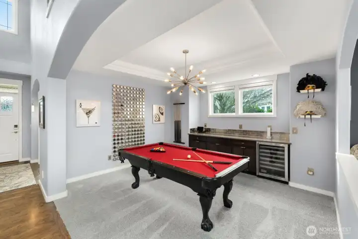 Formal dining off family room with Viking beverage cooler or stunning entertaining space!  Coved ceilings and designer light fixture!