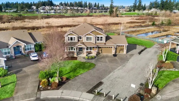 Perfectly located at the end of a cul de sac backing up to wetlands.  This lot features additional parking on the side, four car garage with storage!