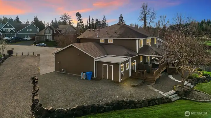 In addition to the four car garage there is additional parking and storage with a low maintenance yard!