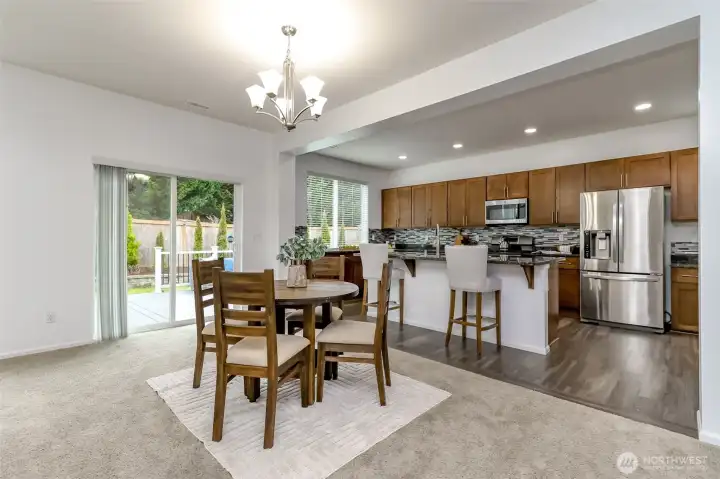 Dining room looking into the kitchen and facing the extra kitchen island seating.