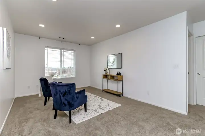 Spacious loft area perfect as a playroom, home gym, movie room, sitting room, craft room or ???