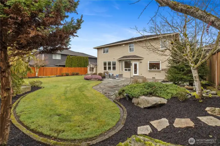 Spacious yard surrounded by privacy fencing.