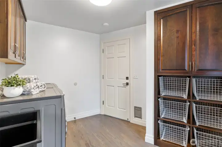 Large laundry room with tons of storage.