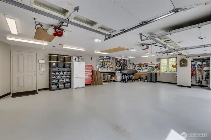 Oversize 3 car garage with epoxy flooring and tons of extra storage.