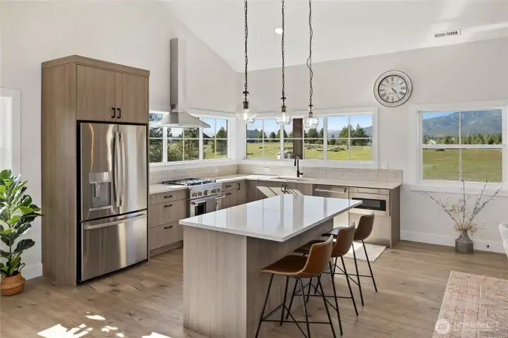 Kitchen designed with ample counter space and a functional eating island for everyday living.