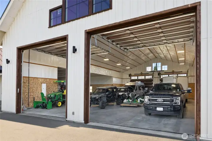 Alternate view of the front-facing 14’ x 14’ garage doors, showcasing their scale and accessibility.