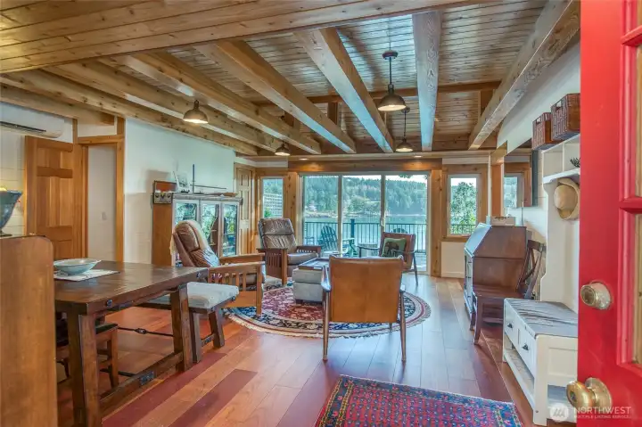 Enter into a warm living room with brazilian cherry floors and an abundance of woodwork and character.