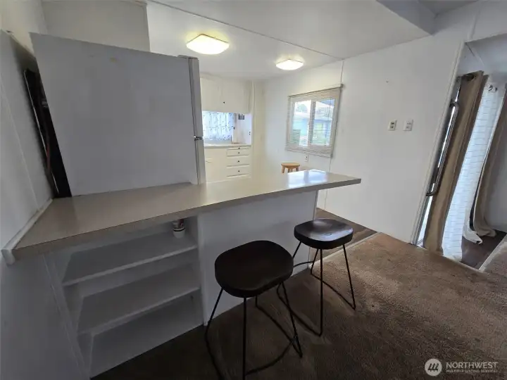 Storage shelves and counter bar.