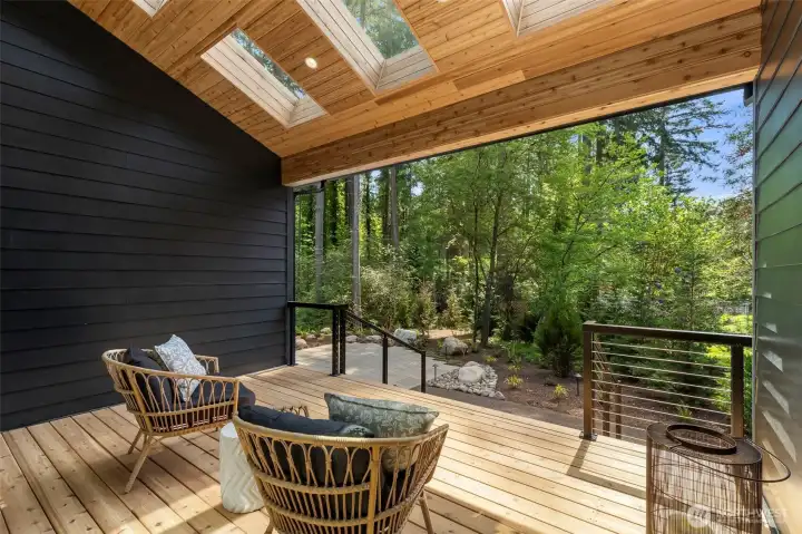 The covered deck has skylights for enjoying more light while under cover and for seeing the stars at night.
