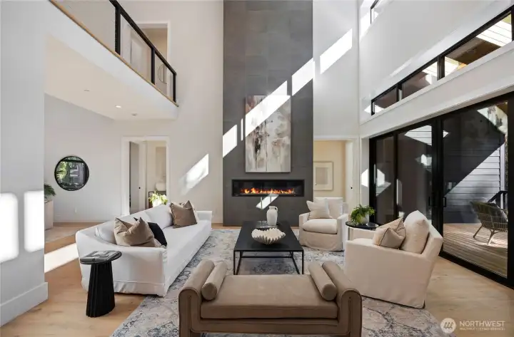 Great room with propane fireplace and 22 ft ceilings