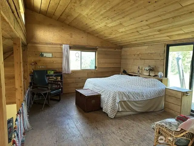 Loft is currently the master bedroom and office space with deck out the sliding doors.