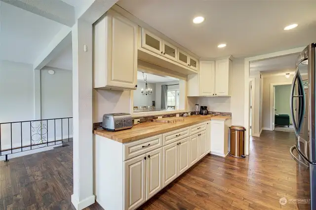 Expansive work space with butcher block countertops.