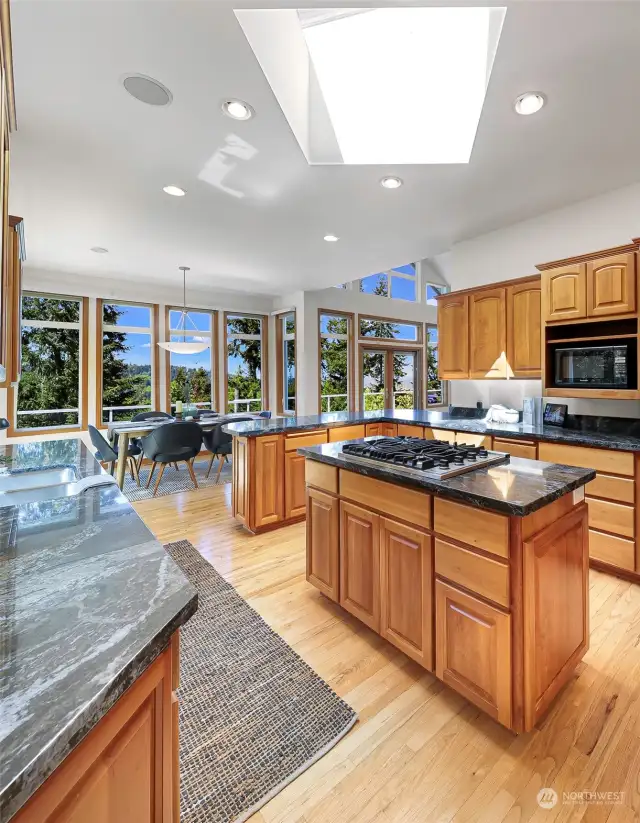 Skylights, south facing windows and western views make cooking and meal time a delight.