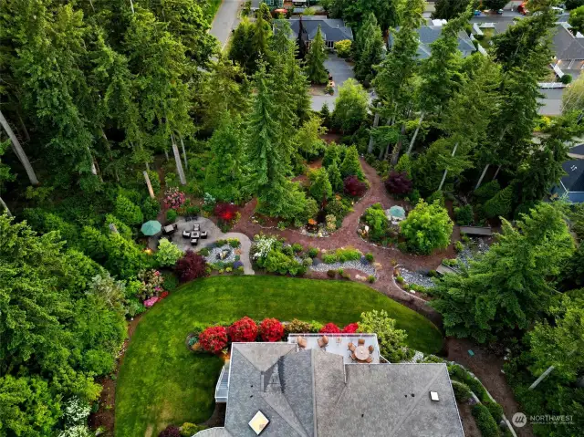 All four lots and buffers were professionally designed and landscaped (2012-2017) by Jodi Trantor and A-1 Landscaping to include over 114 trees, flowering shrubs and native plants, a river rock creek bed with three walking bridges, 26 zone Rainbird irrigation system (internet and locally controlled).