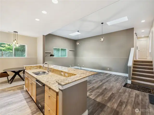 Kitchen looks out into the great room. Up those stairs is a full-bath and two very spacious bedrooms.