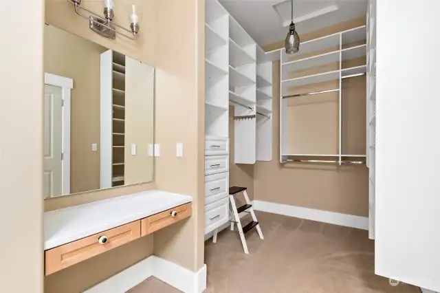 Primary bath with vanity and large walk-in closet