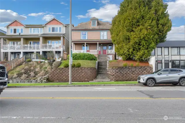 Street view of the Duplex with a large covered front porch.