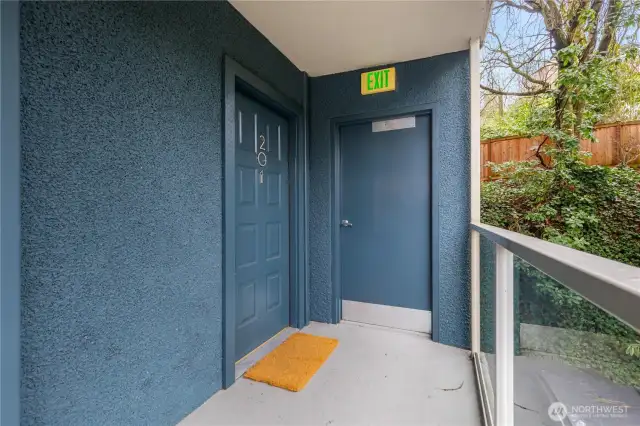 End unit accessed from the open balcony entrance,