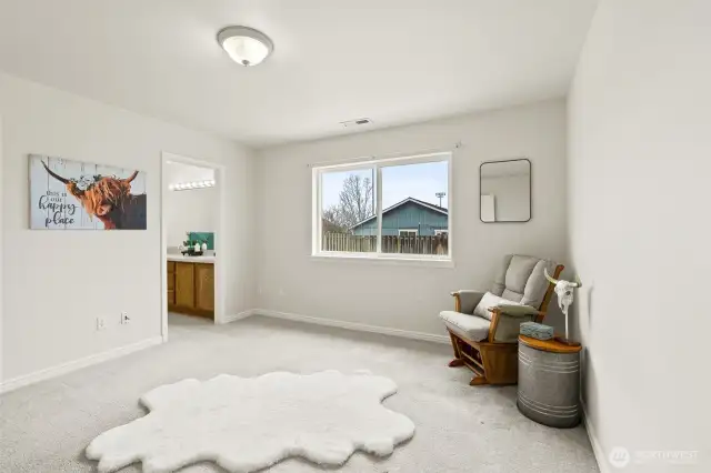 Primary bedroom with bathroom and spacious closet