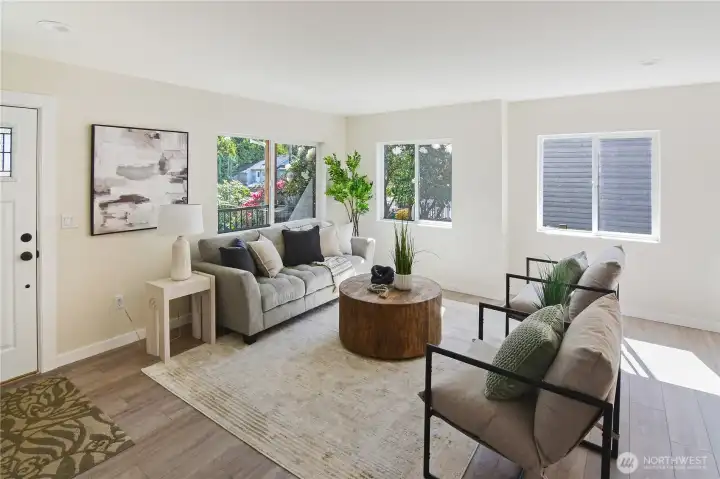 The interior is light and bright with large windows. First living room part of open plan living