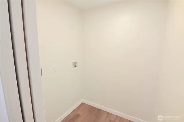 The laundry room is next to the 2 lower bedrooms.