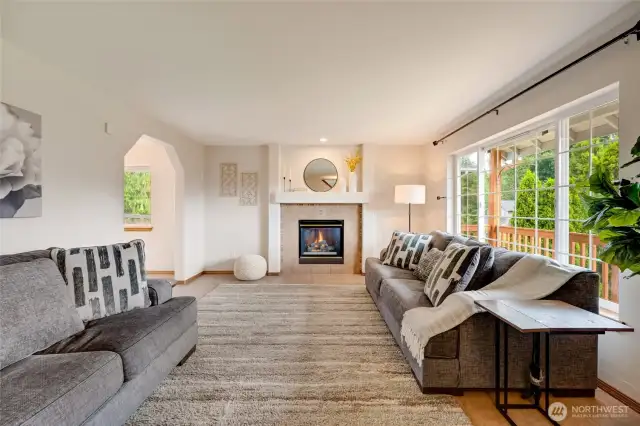 Open floorplan features a large, light filled living room w/ cozy gas fireplace.