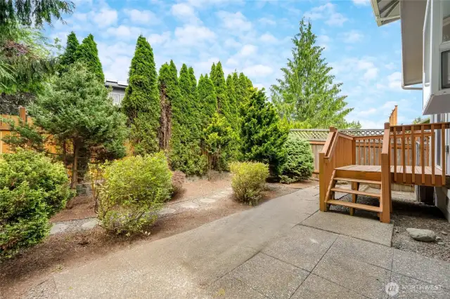 Private, fenced backyard offers perfect entertaining space, play area & convenient dog run.