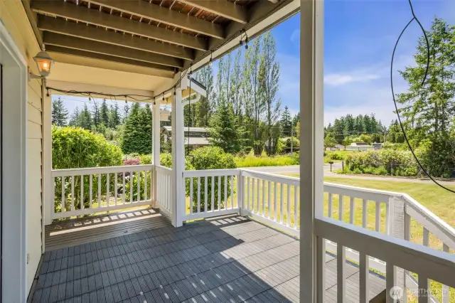 Covered side porch with access to backyard.