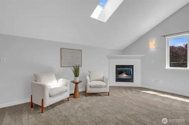 Primary sitting area with gas fireplace.