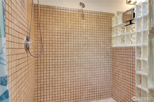 Tiled walk in shower in primary