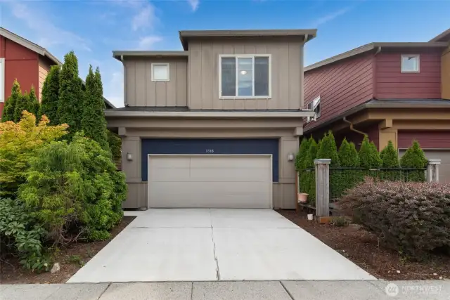 New carpet and fresh paint create a warm, move-in-ready feel. Beautifully landscaped exterior with fresh curb appeal.