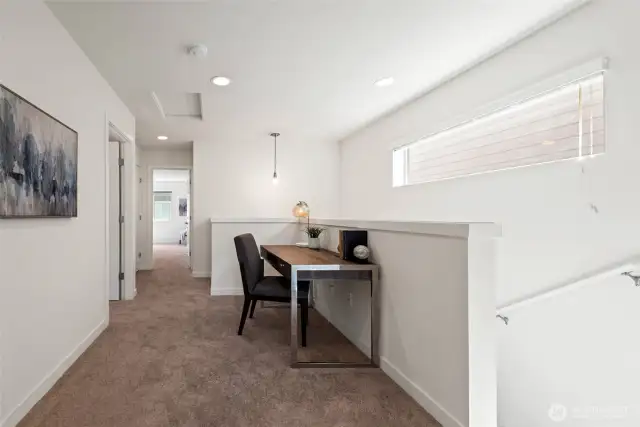 Upstairs loft with writing desk – ideal for work or study.
