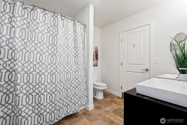 Second upstairs jack and jill bathroom that opens to both adjoining bedrooms