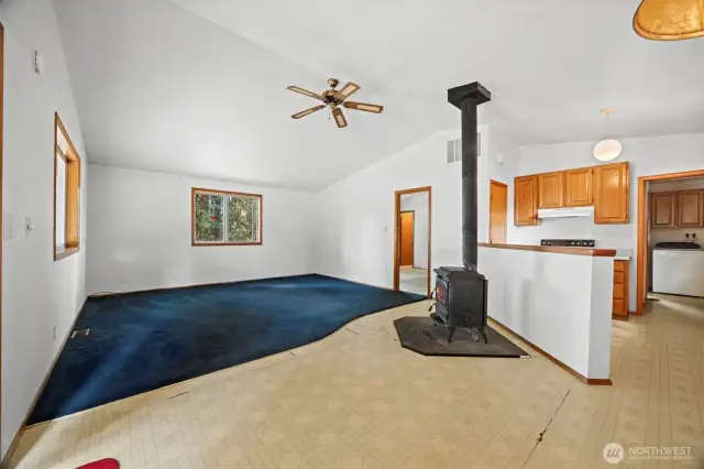 Looking across the spacious living room with the primary bedroom beyond.