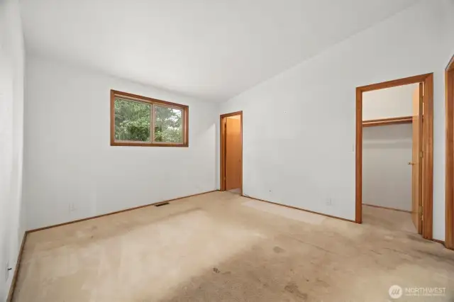 The bedroom has two walk-in closets. The carpet needs to be replaced.