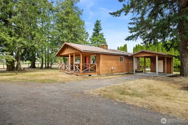 Looking back toward the house with the carport and the pastures beyond.