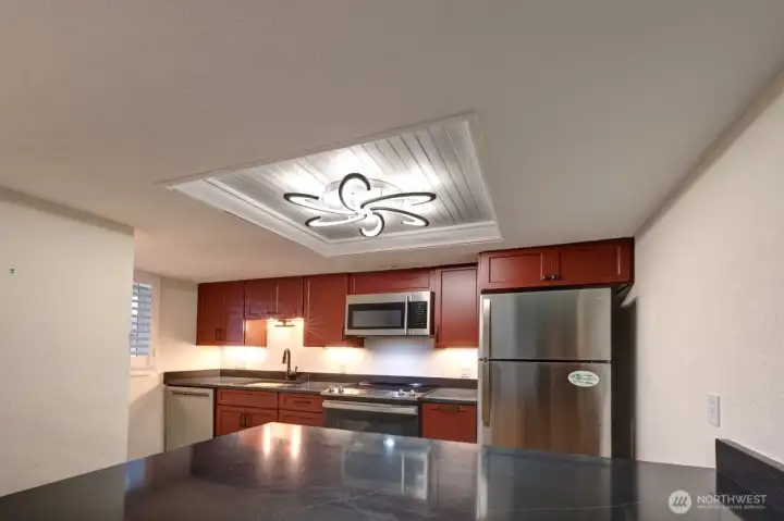 Completely remodeled kitchen with new lighting, flooring, cabinets, counter tops, appliances, fixtures and paint.