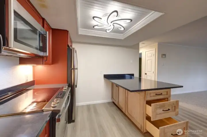 Completely remodeled kitchen with new lighting, flooring, cabinets, counter tops, appliances, fixtures and paint.