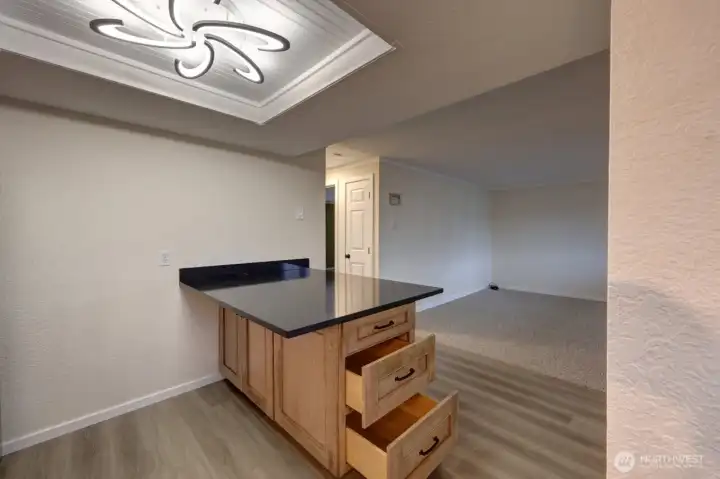 Completely remodeled kitchen with new lighting, flooring, cabinets, counter tops, appliances, fixtures and paint.