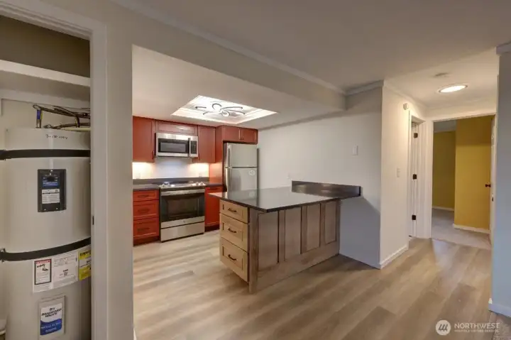 Completely remodeled kitchen with new lighting, flooring, cabinets, counter tops, appliances, fixtures and paint.