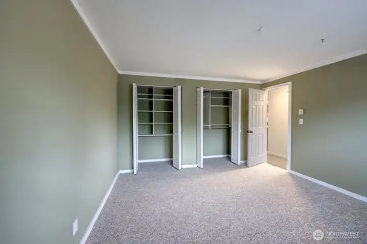 Bedroom #1 with large closet and closet systems already installed. Also new paint and carpet